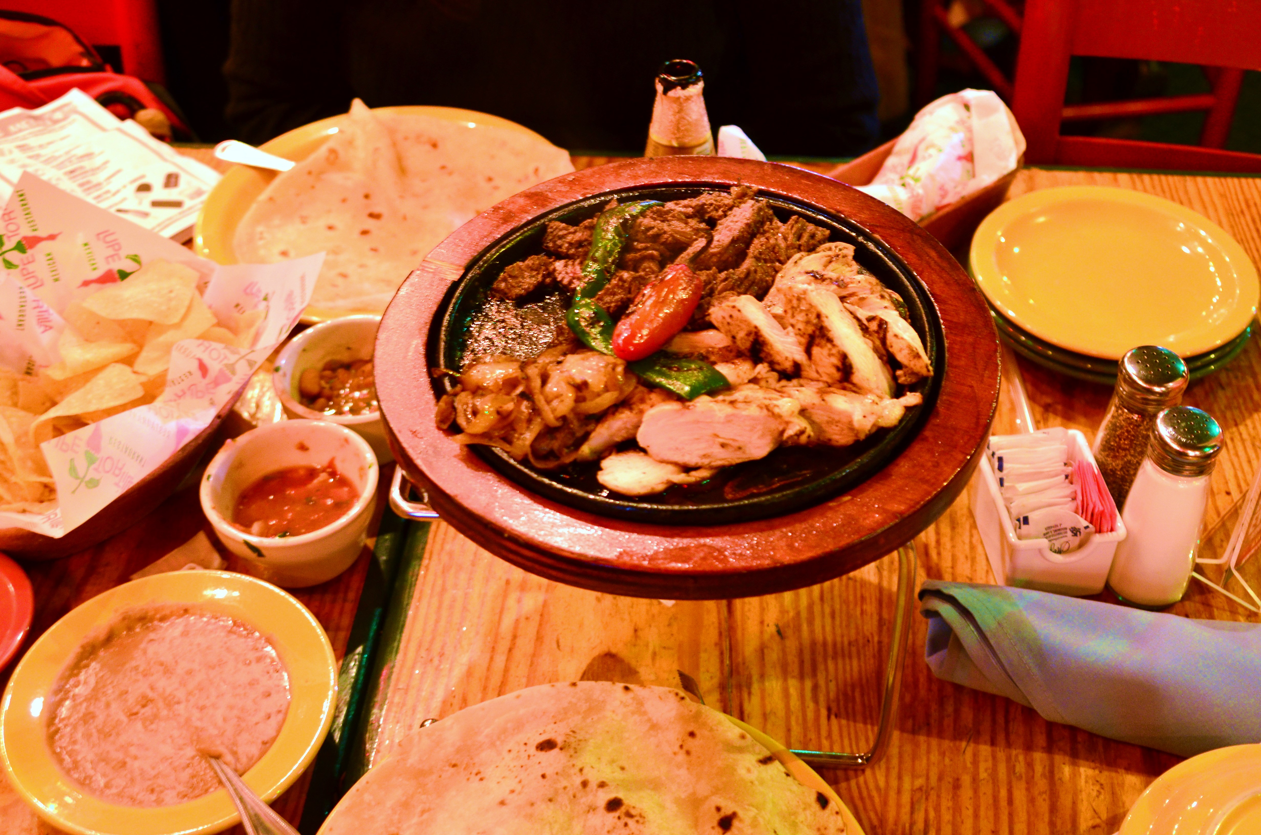 Chicken And Steak Fajitas With Various Accompaniments